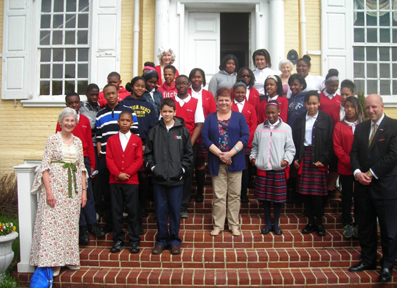 Student participants from HCS, their social studies teacher, Scott Griffiths from Rawle and Henderson Law Firm and volunteers from Woman For Greater Philadelphia pose on the front steps of Laurel Hill Mansion just prior to the 2014 Constitution symposium. 