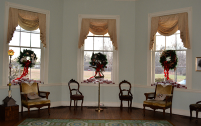 front windows dressed with wreaths