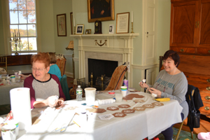 Volunteers from Women For Greater Philadelphia and others making ornaments at Laurel Hill Mansion for the 2022 winter holidays