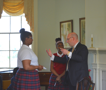 Scott Griffiths from Rawle and Henderson Law Firm discusses a book with two students