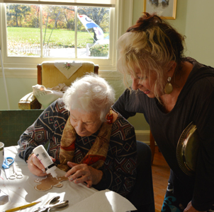 Volunteers from Women For Greater Philadelphia and others making ornaments at Laurel Hill Mansion for the 2022 winter holidays.