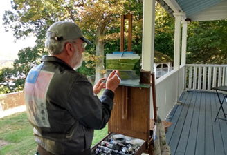 A participant in the Fall 2022 Plein Air painting workshop given at Laurel Hill Mansion by artist Joe Sweeney